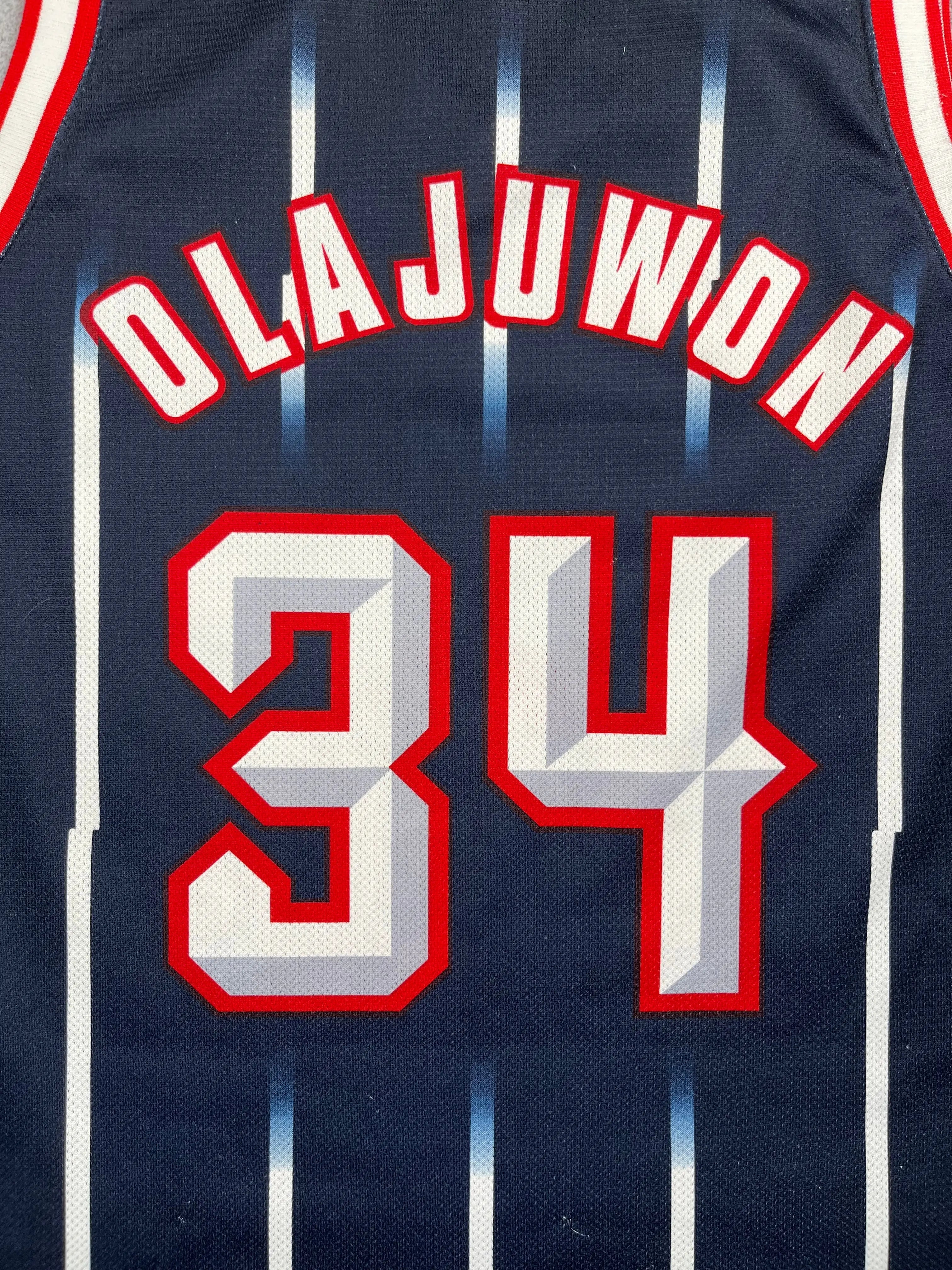 Hakeem Olajuwon #34 - Houston Rockets Away 1996-2001 - Champion (M) - Maillot NBA