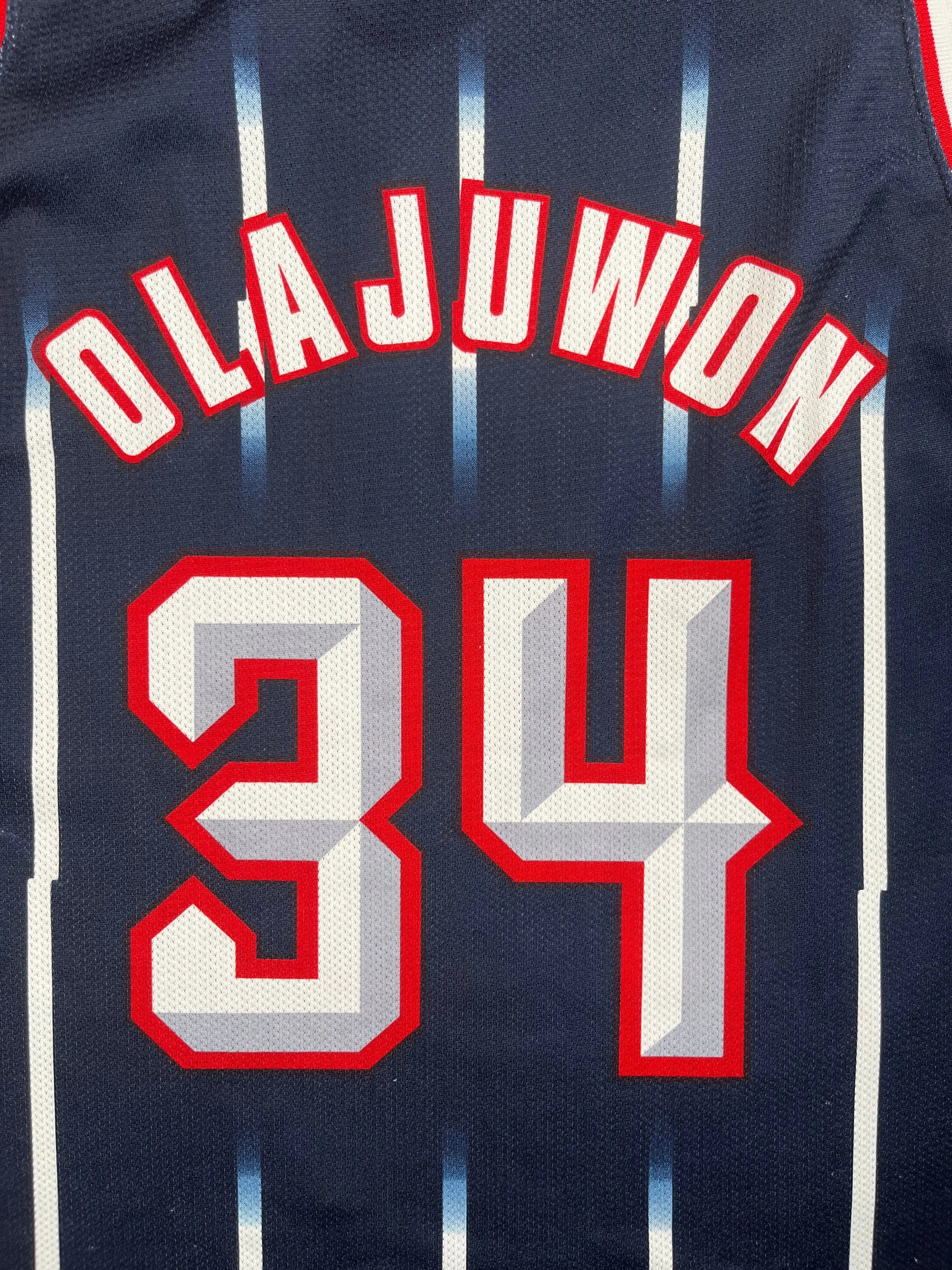 Hakeem Olajuwon #34 - Houston Rockets Away 1996-2001 - Champion (XL) - Maillot NBA Champion